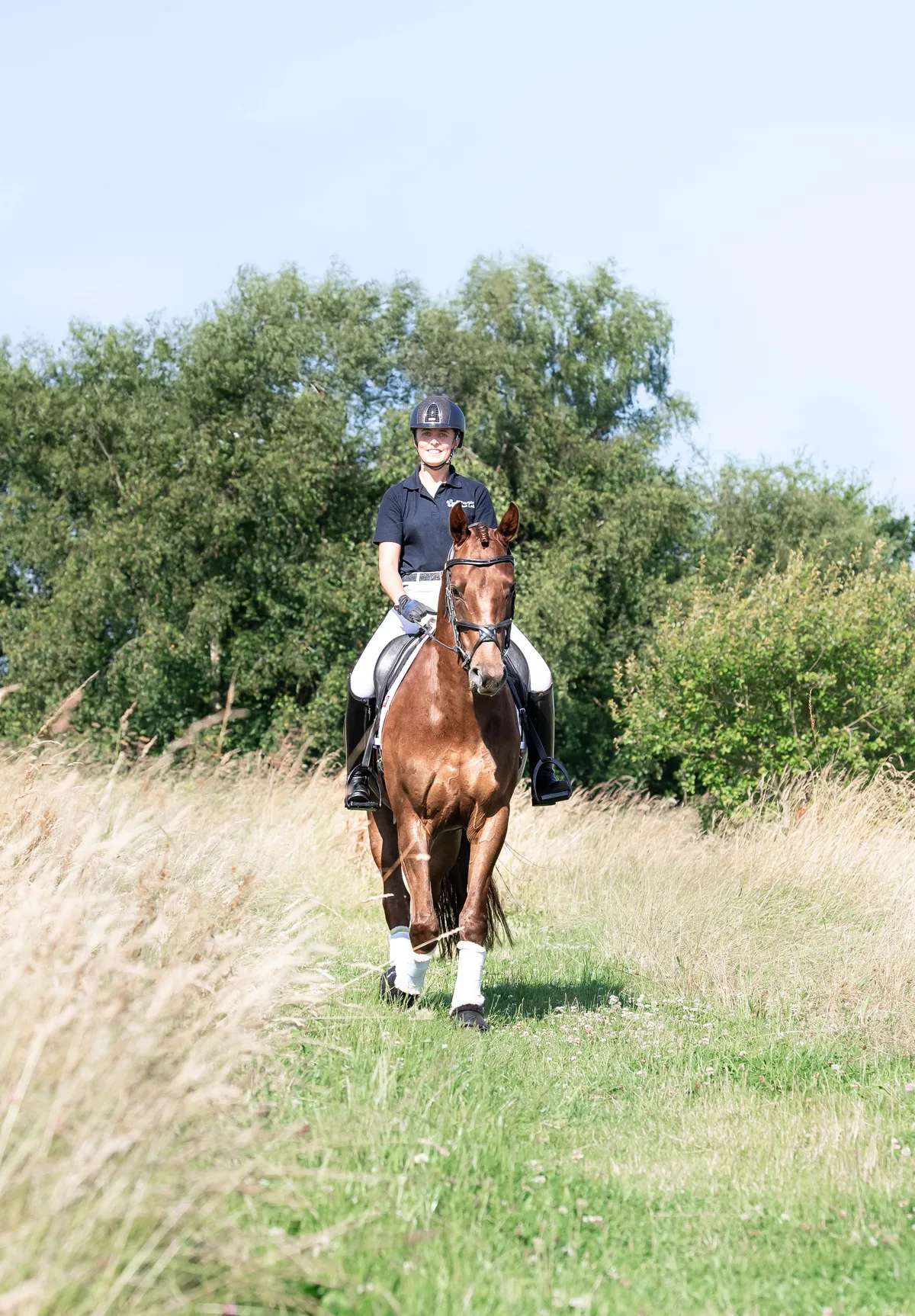 Janine riding a Simple System fed horse